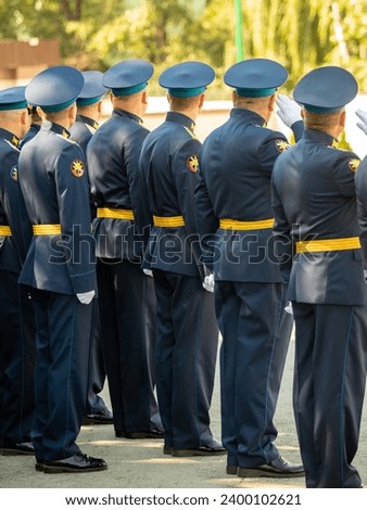 Military pilots at the parade, officers. Russian Air Force Day. Royalty-Free Stock Photo #2400102621