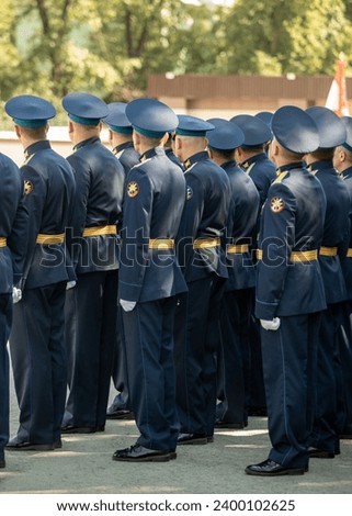 Military pilots at the parade, officers. Russian Air Force Day. Royalty-Free Stock Photo #2400102625