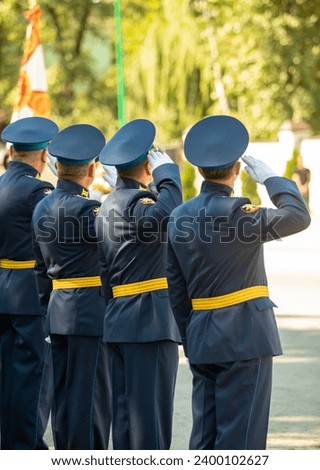 Military pilots at the parade, officers. Russian Air Force Day. Royalty-Free Stock Photo #2400102627