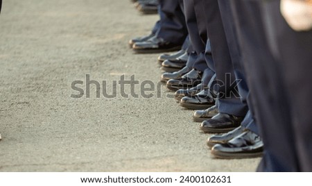 Military pilots at the parade, officers. Russian Air Force Day. Royalty-Free Stock Photo #2400102631