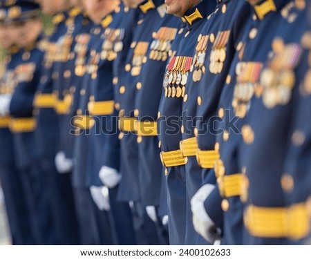 Military pilots at the parade, officers. Russian Air Force Day. Royalty-Free Stock Photo #2400102633