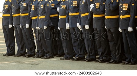 Military pilots at the parade, officers. Russian Air Force Day. Royalty-Free Stock Photo #2400102643