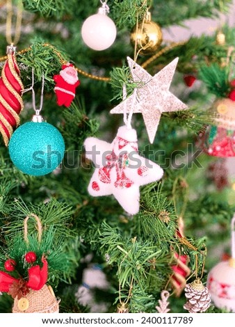 Colorful New Year Ornaments Hanging on the Christmas Tree 
