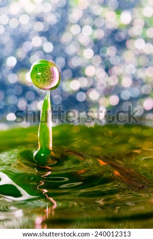Abstract, colorful composition with small bokeh lights, water drops and water texture 