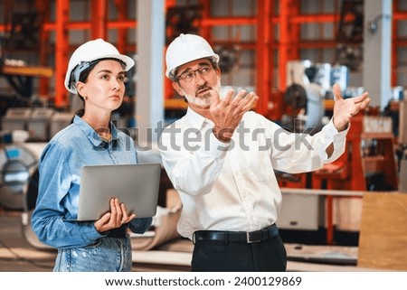 Factory manager or executive make visit metalwork manufacturing factory tour and inspect heavy steel industrial machinery showcase leadership quality as engineering inspection supervisor. Exemplifying