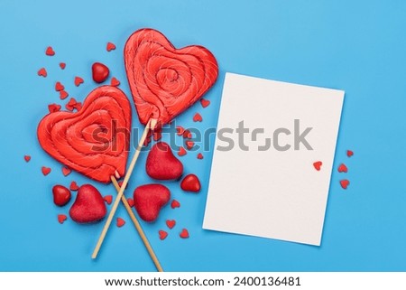 Candy sweets and blank greeting card for your greetings. Valentines day candy hearts. Flat lay