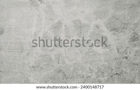 Abstract Rough Dry paint is peeling off the building wall.Close-up. Badly fixed building facade wall covered with cracks in stucco and paint. Missing patch of paint in the middle; crack with flappy. Royalty-Free Stock Photo #2400148717