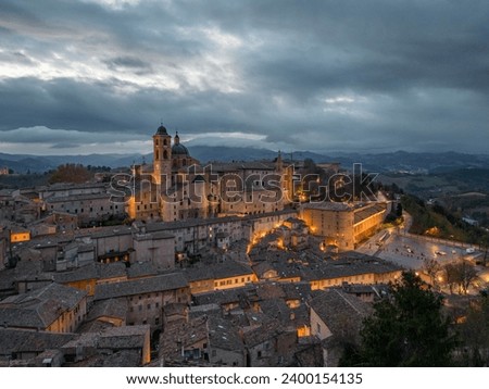 Italy, 08 December 2023 - aerial view at dawn of the medieval village of Urbino in the province of Pesaro and Urbino, a UNESCO heritage site