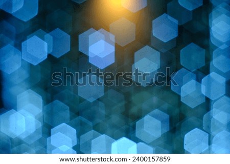 Blurred Lights on dark background, blue color. Copy space, vibrant color. Holidays background. Bokeh and shiny