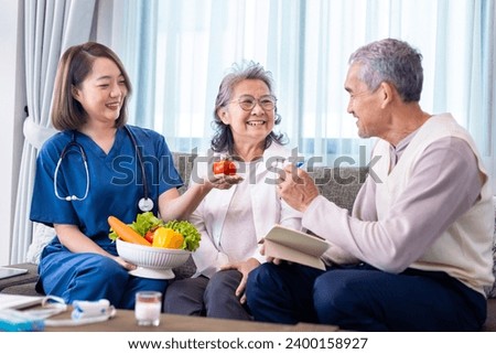 Senior couple get medical advice visit from caregiver nutritionist at home while having suggestion on fresh vegetable meal for healthy eating on probiotic and better digestion system Royalty-Free Stock Photo #2400158927