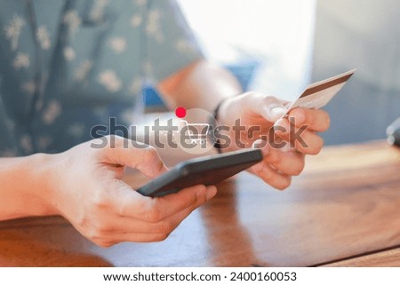 close up customer man hand pressing on marketplace website with virtual icon of online shopping cart to select and make payment by credit card for global business and lifestyle concept Royalty-Free Stock Photo #2400160053