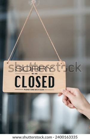 Owner puts a closed sign on the bar or restaurant glass door or window.