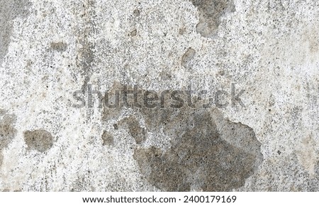 Abstract Rough Dry paint is peeling off the building wall.Close-up. Badly fixed building facade wall covered with cracks in stucco and paint. Missing patch of paint in the middle; crack with flappy. Royalty-Free Stock Photo #2400179169