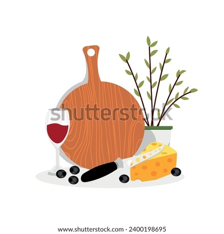 Cutting board with knife, glass of wine, cheese and olives on wh