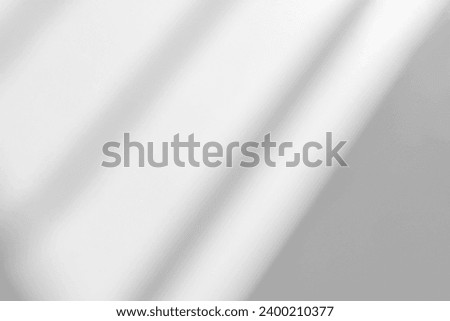 Gray shadow and light blur abstract background on white wall  from window. Dark stripe grey shadows indoor in room  background, monochrome, shadow overlay effect for backdrop and mockup design
