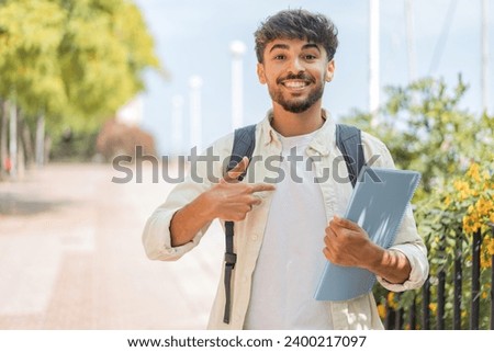 Young student Arabian man at outdoors with surprise facial expression