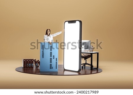E-commerce. Smiling woman with big credit card pointing at big 3D model of giant phone with empty screen over beige background. Wireless cash. E-payment. Mockup for text, ad, design, logo