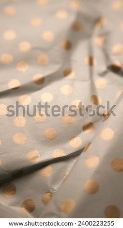 Crumpled polka dot gift paper