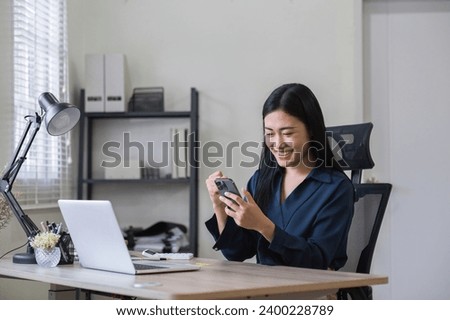 Young woman holding a credit card and using a laptop online shopping and pay online through an application on smartphone