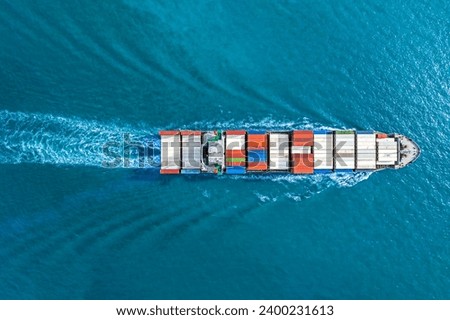 Aerial top view container ship vessel cargo carrier at blue sea. Royalty-Free Stock Photo #2400231613