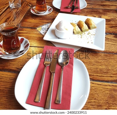 Delicious Turkish baklava served with ice cream and Turkish tea