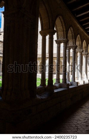 Views of interior of old church of medieval town St. Emilion, production of red Bordeaux wine on cru class vineyards in Saint-Emilion wine making region, France, Bordeaux in sunlights Royalty-Free Stock Photo #2400235723