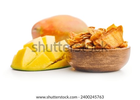 Dried mango fruit in bowl isolated on the white background.