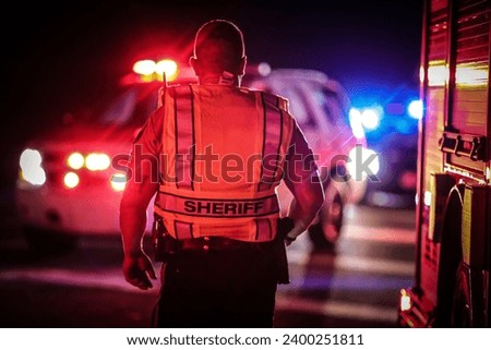 Sheriff Deputy on scene of crime Royalty-Free Stock Photo #2400251811
