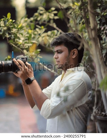 A young photographer with camera
