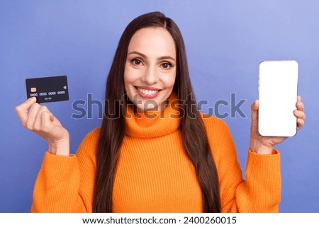 Photo of beautiful woman wear turtleneck show features eshopping use nfc credit card cellphone display isolated on violet color background