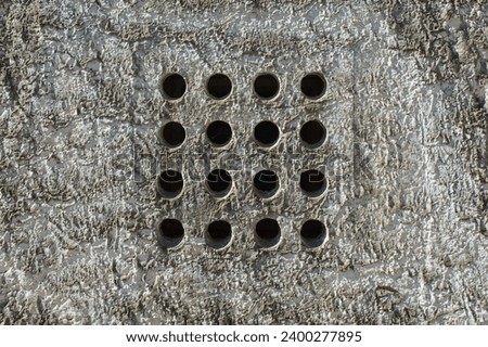 Ventilation holes in a wall of an old building in Novi Vinodolski, Primorje-Gorski Kotar County, Croatia Royalty-Free Stock Photo #2400277895