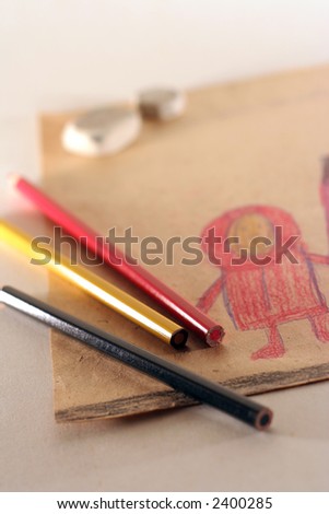 The still life photo of children's drawing and colored pencils