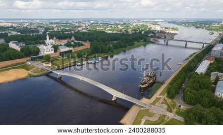Aerial view of the bridges over the Volkhov River in Veliky Novgorod, river transport and tourism in the city Royalty-Free Stock Photo #2400288035