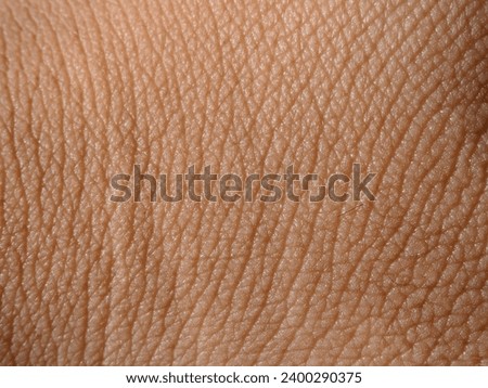 macro shot detail of human skin texture ( hand skin )  Royalty-Free Stock Photo #2400290375