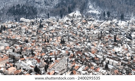 Brasov, Transylvania, Romania. Aerial panoramic view of the old town and Council Square, in the historic center of Brasov city. Bird's eye view.