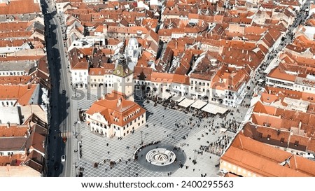 Brasov, Transylvania, Romania. Aerial panoramic view of the old town and Council Square, in the historic center of Brasov city. Bird's eye view.