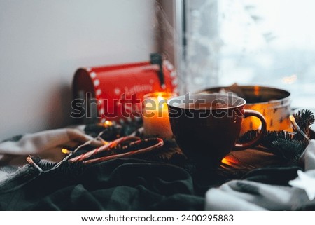 A cup of tea with smoke in a Christmas atmosphere, mood.