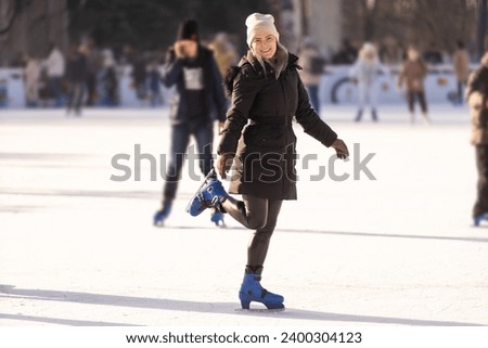 winter lady portrait outside. woman at the skating rink