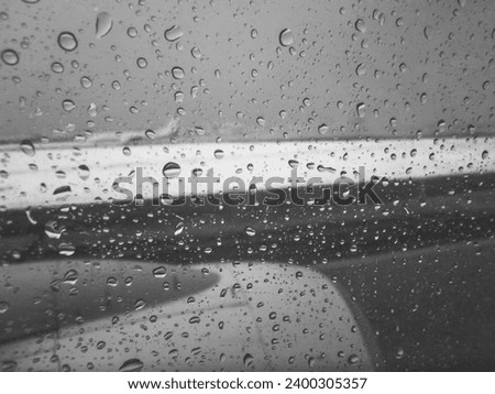 View From Airplane Cabin When Raining Outside Water Droplet On Window Abstract Pattern Infrared Black and White Colour