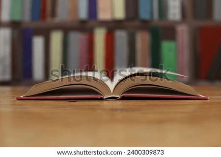 Open book on the table in library