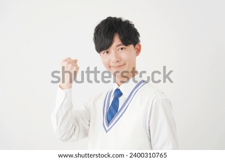 Asian high school boy guts pose gesture in white background