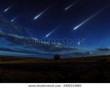 Beautiful starfall in the twilight sky. A stream of meteors reached the Earth. Meteorites glow over the fields. Sci-fi landscape.