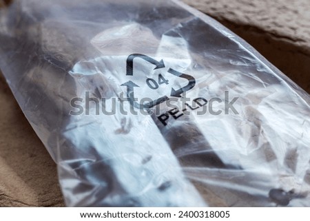Plastic recycling symbol 04 PE-LD on packaging. Low-density polyethylene. For plastics recycling. Royalty-Free Stock Photo #2400318005