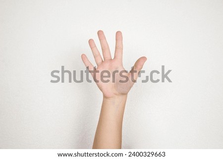 Child hand on white background. hand up, five, palm, isolated on a white background