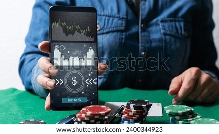 smartphone with IPO graphics. app is open on smart phone - Stock chart is visible in the background. online marketplace for freelance digital services.