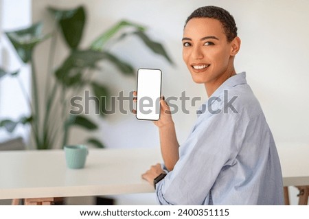 Smiling person in casual show smartphone with blank screen, recommendation app promotion or mobile technology use. Online services, connectivity, ad and offer, sale