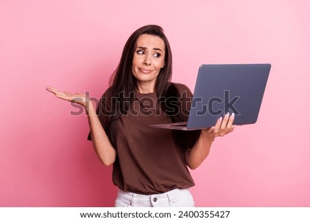 Photo of young brunette hair lady shrug shoulders has no idea when someone asking her during meet online isolated on pink color background
