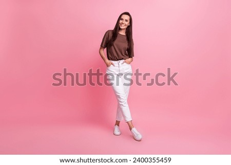 Full length photo of nice positive satisfied person put arms pockets empty space isolated on pink color background