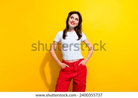 Photo of dreamy woman with retro hairstyle dressed white t-shirt look at proposition empty space isolated on yellow color background