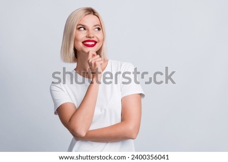 Photo of pretty cute minded girl dressed trendy clothes look up empty space banner isolated on grey color background